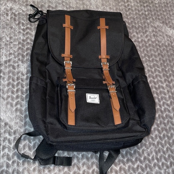 Herschel Little America™ Backpack - 30L. Black with brown straps.‎